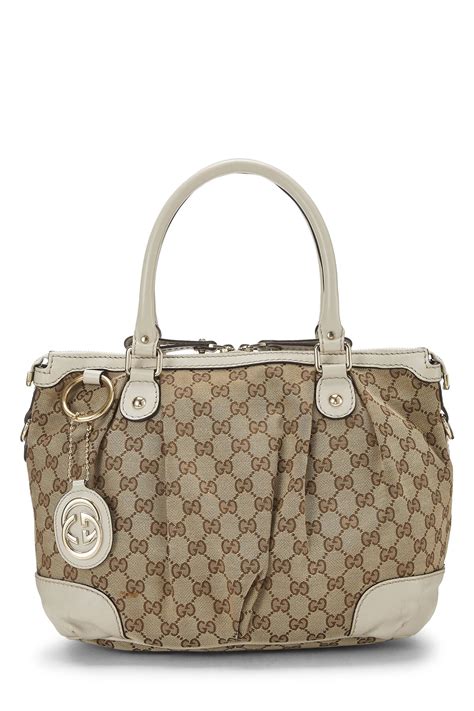 sukey hobo grigia gucci|Gucci White Original GG Canvas Sukey Hobo QFB1FIJYWB014.